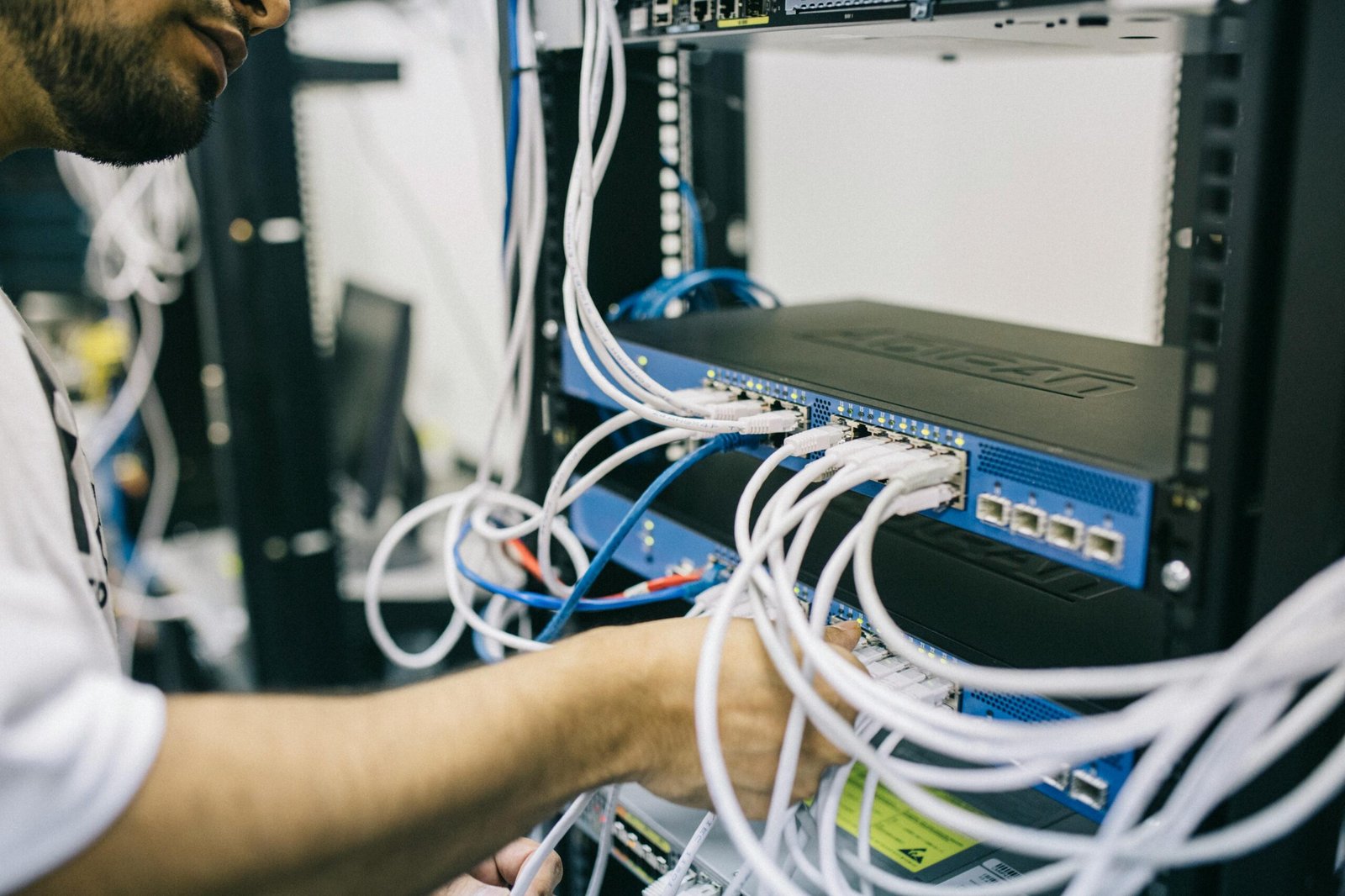 Technician performing professional WiFi network diagnostics in Qatar
